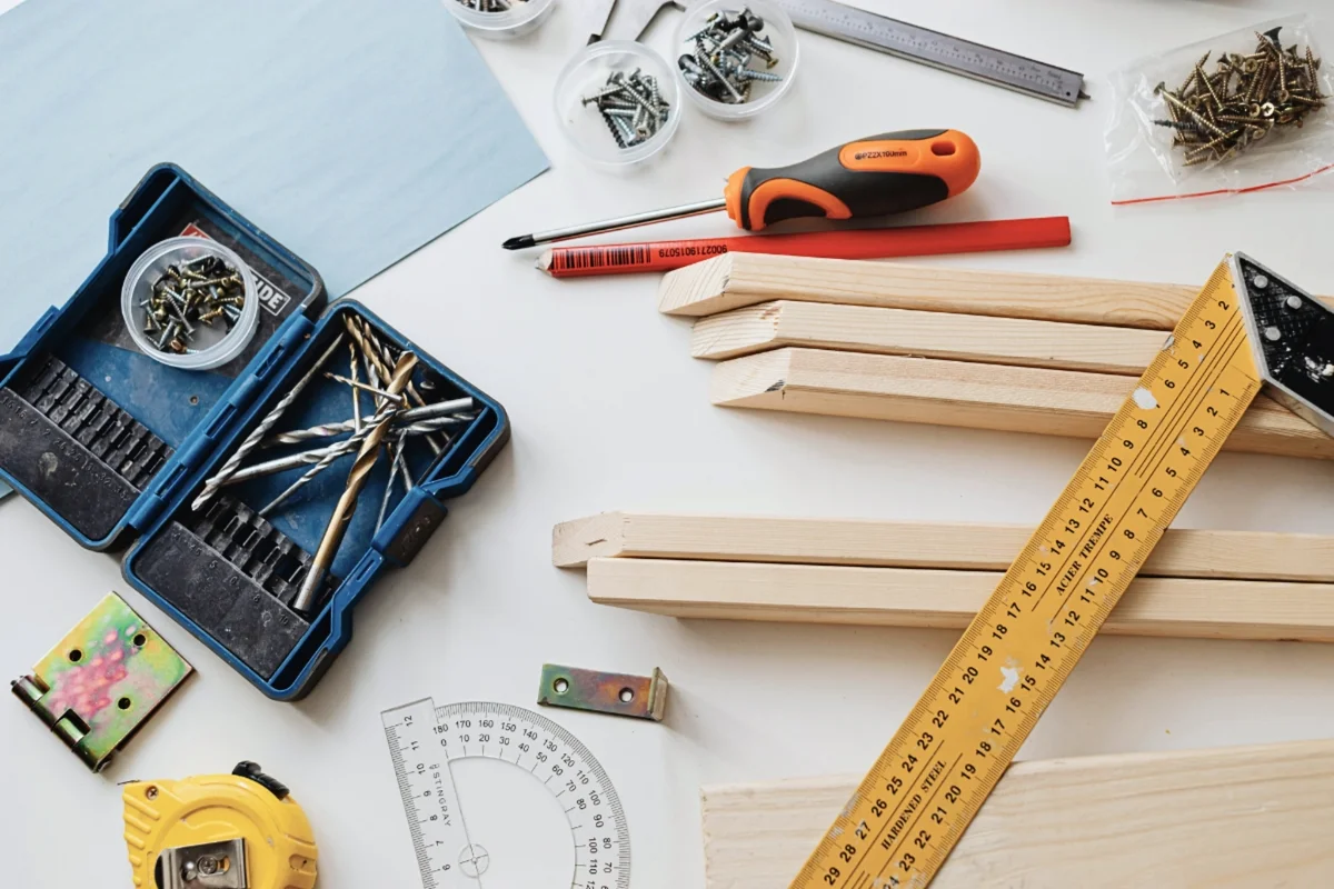 DIY home fixes tools and wood pieces on a clean workbench