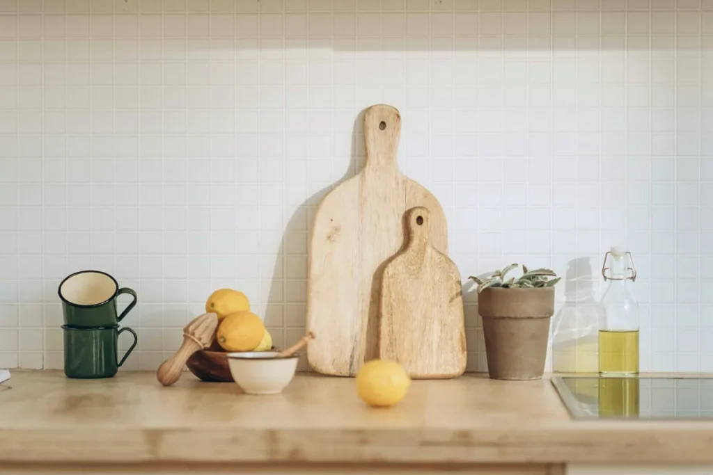 Kitchen counter with cutting boards, lemons, and oil bottle