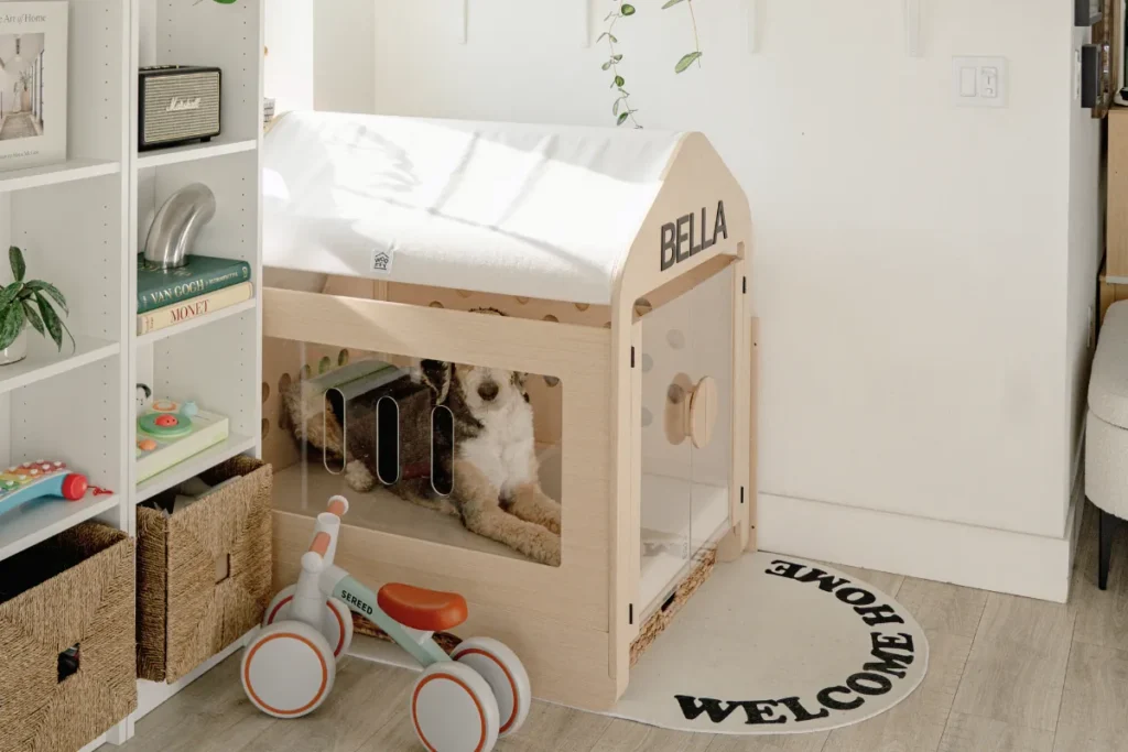 Dog crate nook with storage shelves in a bright home corner